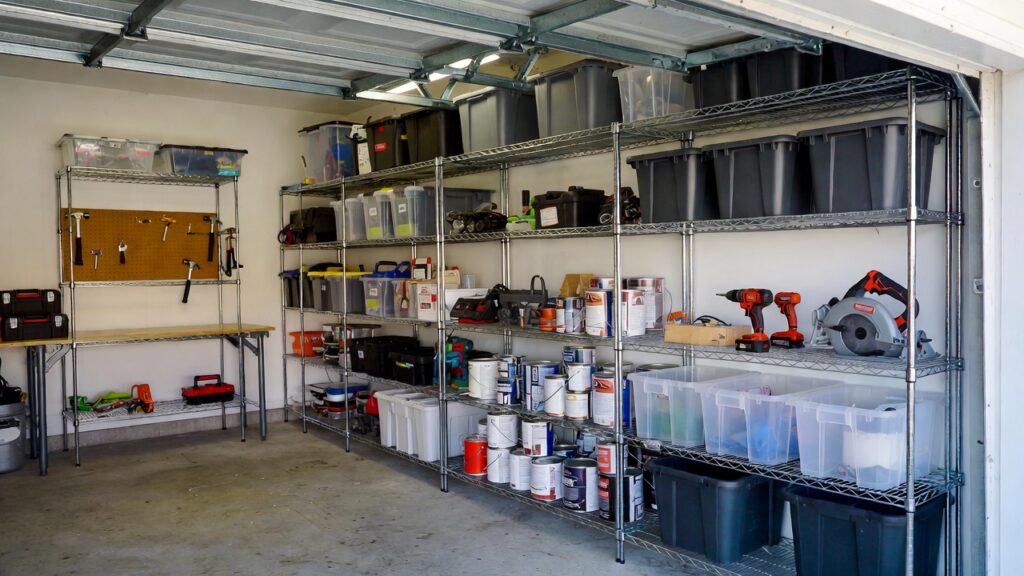 A perfectly organized garage featuring a chrome heavy duty wire storage shelving unit holding tools and bins. A perfectly organized garage featuring a chrome heavy duty wire storage shelving unit holding tools and bins.