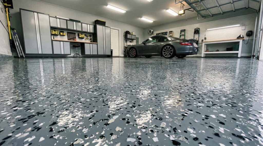 A clean, shiny, professional-looking epoxy garage floor. A clean, shiny, professional-looking epoxy garage floor