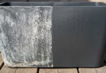 How to Remove Hard Water Stains From Outdoor Plastic (Furniture & Planters) A dynamic side-by-side visual comparison of a dark plastic planter heavily covered in white hard water stains on the left, and a clean, dark, restored surface on the right, demonstrated outdoors in the sunlight.
