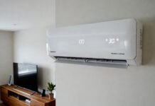 Power Efficient Air Conditioner 2026: Real Tests & Low Power Models Modern power efficient inverter air conditioner mounted in a living room