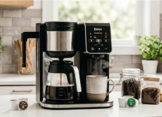 Best Dual Coffee Maker Review 2026: 5 Top 2-Way Machines A professional lifestyle photograph capturing a Ninja DualBrew Pro CM401 Dual Coffee Maker actively brewing a full carafe of coffee and a single K-Cup cup simultaneously on a modern kitchen counter