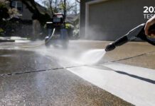 Best Electric Pressure Washer 2026: Here’s What Actually Works A homeowner using a powerful electric pressure washer to clean a dirty concrete driveway, showcasing the massive cleaning power of the best 2026 models.