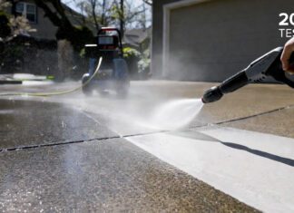Best Electric Pressure Washer 2026: Here’s What Actually Works A homeowner using a powerful electric pressure washer to clean a dirty concrete driveway, showcasing the massive cleaning power of the best 2026 models.