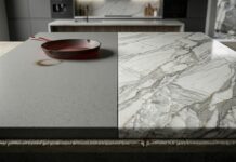 Quartz vs. Quartzite Countertops (Differences & Cost) A side-by-side visual comparison of engineered quartz vs. natural quartzite countertops. The gray quartz slab on the left shows a scorch mark from a hot cast-iron skillet, emphasizing its lower heat resistance. The polished natural quartzite slab on the right, with prominent gray veining, remains flawless, demonstrating its extreme durability and heat resistance.