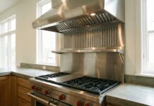 1000 CFM Range Hoods and 1200 CFM Vent Hoods 2026: My Real-World DIY Reality Check A modern pro-style 1000 CFM stainless steel range hood installed over a large gas cooktop in a residential kitchen.
