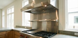 1000 CFM Range Hoods and 1200 CFM Vent Hoods 2026: My Real-World DIY Reality Check A modern pro-style 1000 CFM stainless steel range hood installed over a large gas cooktop in a residential kitchen.