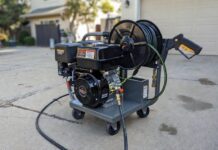 The Ultimate 4000 PSI Pressure Washer Buyer’s Guide A heavy-duty commercial 4000 PSI gas powered pressure washer with a hose reel on a concrete driveway.