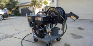 The Ultimate 4000 PSI Pressure Washer Buyer’s Guide A heavy-duty commercial 4000 PSI gas powered pressure washer with a hose reel on a concrete driveway.