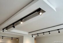 Magnetic Track Lighting System: The Real 2026 Guide A modern living room ceiling featuring a sleek recessed magnetic track light system with adjustable spotlights