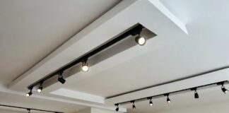 Magnetic Track Lighting System: The Real 2026 Guide A modern living room ceiling featuring a sleek recessed magnetic track light system with adjustable spotlights