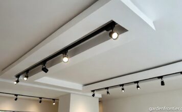Magnetic Track Lighting System: The Real 2026 Guide A modern living room ceiling featuring a sleek recessed magnetic track light system with adjustable spotlights