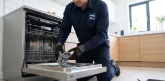 Beko Dishwasher Review & Troubleshooting Guide (2026) A technician repairing a Beko dishwasher to fix draining issues and E01 error codes.