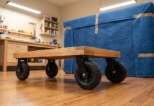 Best Four Wheel Dolly Guide: Protect Floors & Move Heavy Loads (2026) A heavy-duty wooden four wheel dolly with rubber casters used for moving furniture