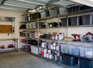 Best Heavy Duty Shelving for Garages & Warehouses (2026) A perfectly organized garage featuring a chrome heavy duty wire storage shelving unit holding tools and bins.