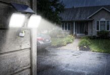 Best Solar Flood Lights: What to Look for Before Buying Solar flood lights installed above a garage and lighting a driveway at night