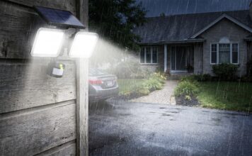 Best Solar Flood Lights: What to Look for Before Buying Solar flood lights installed above a garage and lighting a driveway at night