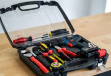 Best Tool Kit With Drill For Home (2026 DIY Starter Kits) An open, neatly organized home tool kit featuring a cordless drill on a wooden workbench ready for a DIY project.