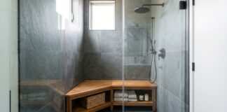 Corner Shower Bench: Best Types, Sizes, Materials & Buying Tips A teak corner shower bench placed inside a modern walk-in shower