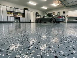 How Much Does Epoxy Flooring Cost? (2026 DIY Guide) A clean, shiny, professional-looking epoxy garage floor