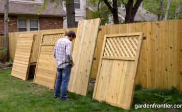Fencing Types 2026: The Ultimate Guide to Backyard Fences A homeowner inspecting different wood fencing types in a residential backyard.