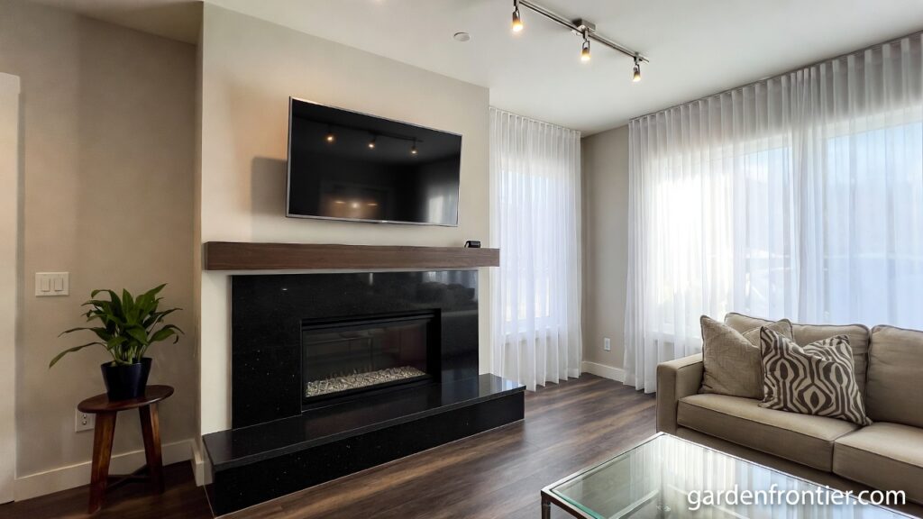 A comprehensive 2026 design guide for choosing, installing, and maintaining a natural granite fireplace surround and hearth A modern living room featuring a sleek black granite fireplace surround and hearth.