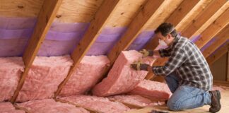 How to Insulate an Attic Roof Rafters: Best Materials & Steps (2026) Installing fiberglass insulation and ventilation baffles between attic roof rafters.