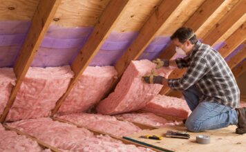 How to Insulate an Attic Roof Rafters: Best Materials & Steps (2026) Installing fiberglass insulation and ventilation baffles between attic roof rafters.