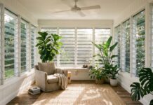 Louvered Windows (2026): Maximize Natural Airflow Modern glass louvered windows open in a bright, breezy sunroom.