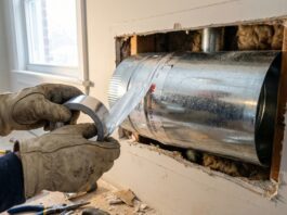Max CFM 6 Inch Duct (2026): Fixing My 800 CFM Hood Mistake A DIY installation of an 8-inch rigid metal duct being sealed with HVAC foil tape above a powerful kitchen range hood.