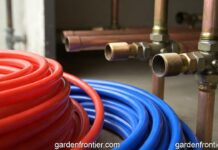 PEX vs Copper Repipe: 2026 Cost, Longevity & Pros/Cons A side-by-side comparison of flexible red and blue PEX tubing next to rigid copper plumbing pipes.