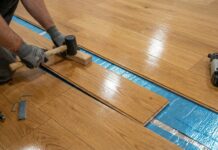 Pre Finished Hardwood Flooring (2026): Inspector’s Guide A beautiful pre-finished hardwood floor being installed over premium underlayment in a modern home.