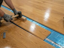 Pre Finished Hardwood Flooring (2026): Inspector’s Guide A beautiful pre-finished hardwood floor being installed over premium underlayment in a modern home.