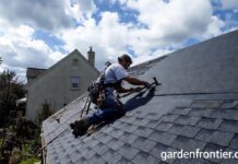 Roof Replacement Cost & Timing (2026): A $22k Mistake A professional roofer installing new architectural asphalt shingles on a residential home.
