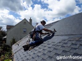 Roof Replacement Cost & Timing (2026): A $22k Mistake A professional roofer installing new architectural asphalt shingles on a residential home.