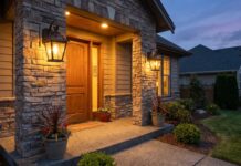Solar Outdoor Wall Lanterns: Best Types, Features & Buying Tips Solar outdoor wall lanterns mounted beside a front door at night