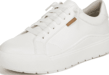 Dr. Scholl’s Time Off Sneaker Review: Are They Actually Comfortable? A pair of white Dr. Scholl's Time Off Platform Sneakers styled casually outdoors