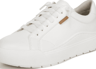 Dr. Scholl’s Time Off Sneaker Review: Are They Actually Comfortable? A pair of white Dr. Scholl's Time Off Platform Sneakers styled casually outdoors