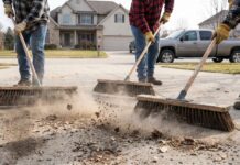 The Best Outdoor Push Brooms for Patios, Concrete & Garages Heavy-duty outdoor push brooms cleaning a concrete driveway