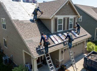 Asphalt Shingle Roof Replacement: Lifespan, Materials & Installation Steps Roofing contractors installing architectural asphalt shingles during a roof replacement