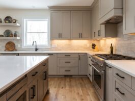 Greige Kitchen Cabinets: Best Warm Neutral Colors, Hardware & Countertops Modern kitchen with warm greige cabinets white quartz countertops black hardware and soft neutral lighting