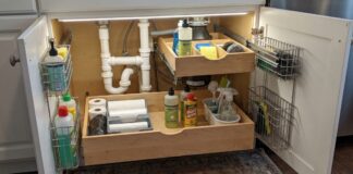 Best Under Sink Pull Out Drawers: Organizers for Kitchen and Bathroom Cabinets Under sink pull out drawers installed below a kitchen sink with cleaning supplies organized around plumbing pipes