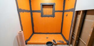Waterproof Membrane for Shower: What Goes Behind Tile and Why It Matters A waterproof membrane for shower walls and floor being installed before tile in a bathroom remodel