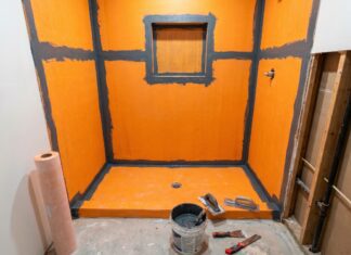 Waterproof Membrane for Shower: What Goes Behind Tile and Why It Matters A waterproof membrane for shower walls and floor being installed before tile in a bathroom remodel