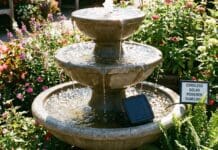 Best Solar Pump for Fountains & Bird Baths (2026 Guide) Floating solar water pump operating in a stone garden bird bath under direct sunlight