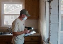 Exterminator Prices: Average Pest Control Costs by Pest Type Pest control technician inspecting a residential kitchen and exterior wall for common household pests