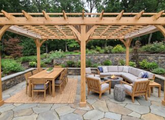 Freestanding 20×10 Pergola Kit: Patio Size, Shade & Buying Guide Freestanding 20x10 pergola kit installed over a rectangular patio with outdoor dining furniture and lounge seating