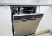 Sharp Dishwasher Reviews: Best Models, Pros, Cons & Value Picks Stainless steel Sharp dishwasher installed in a modern kitchen with clean dishes and silverware racks