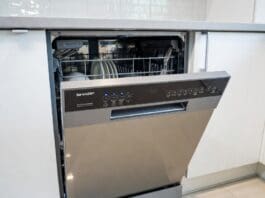 Sharp Dishwasher Reviews: Best Models, Pros, Cons & Value Picks Stainless steel Sharp dishwasher installed in a modern kitchen with clean dishes and silverware racks