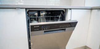 Sharp Dishwasher Reviews: Best Models, Pros, Cons & Value Picks Stainless steel Sharp dishwasher installed in a modern kitchen with clean dishes and silverware racks