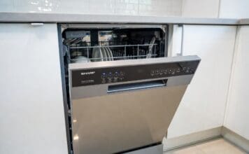 Sharp Dishwasher Reviews: Best Models, Pros, Cons & Value Picks Stainless steel Sharp dishwasher installed in a modern kitchen with clean dishes and silverware racks